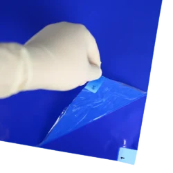 Adhesive Mats - peeling back layers of blue mat to reveal second layer