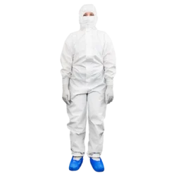 Cleanroom operative wearing a disposable coverall, mask and overshoes