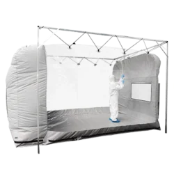 Portable cleanroom tent - shot of fully gowned cleanroom operative cleaning the inside of the tent - shot from outside the tent